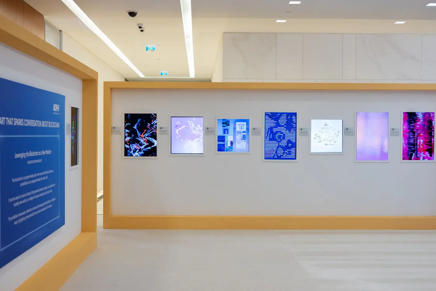 Indoor gallery wall with a row of portrait screens