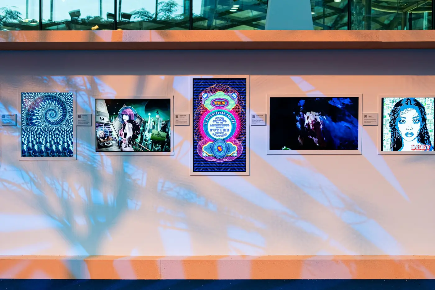 Straight-on view of the outdoor wall of artworks