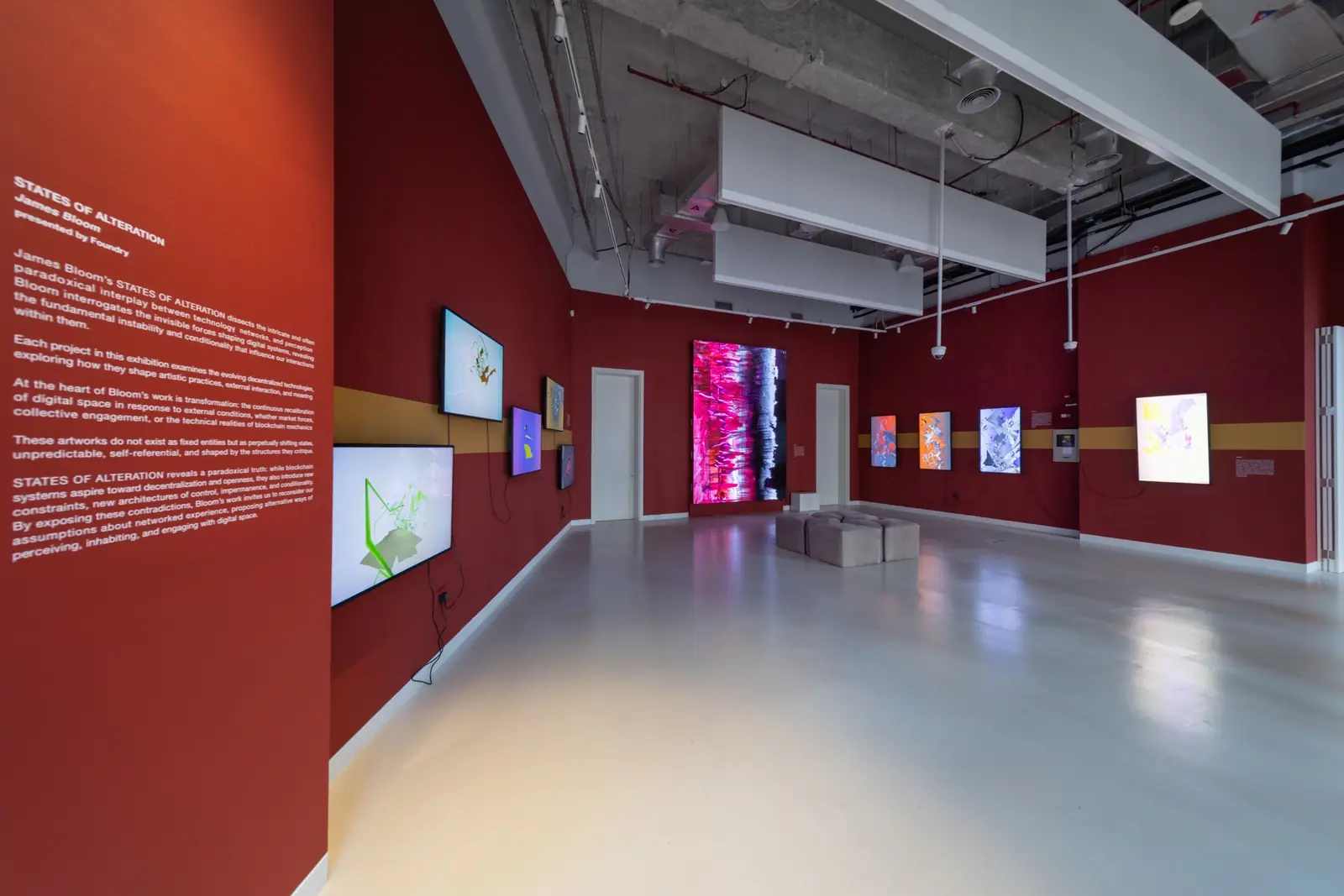 Entrance wall text for States of Alteration with screens beyond