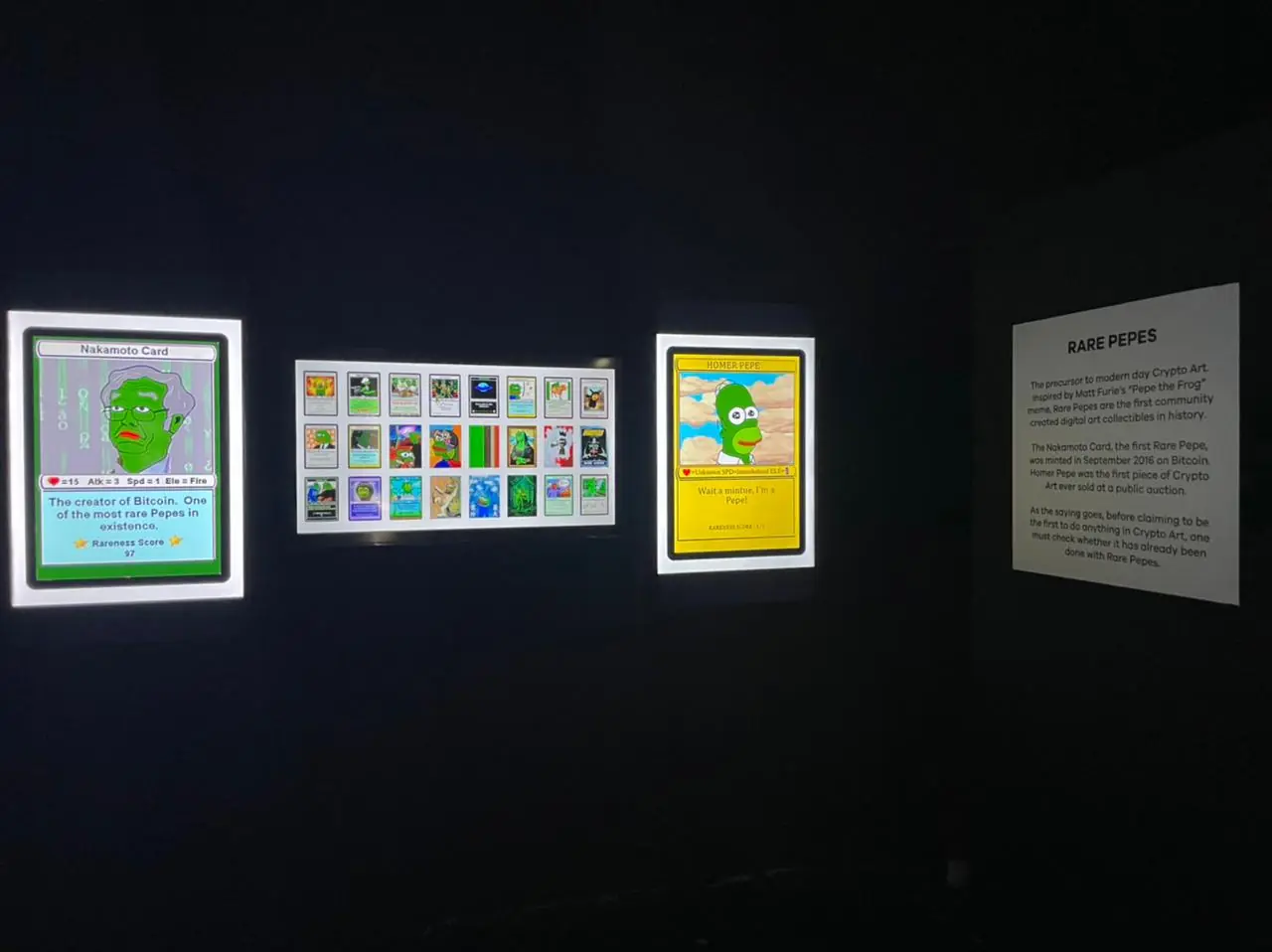 Rare Pepe cards displayed on illuminated screens with an explanatory panel