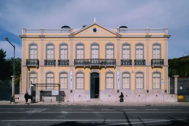 The yellow façade of Palacete Gomes Freire in Lisbon